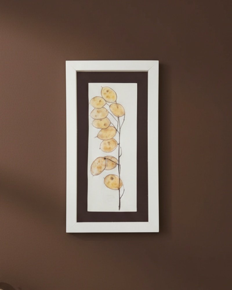 A framed "Large Colourful Meadow Mix – Fine Art Print" with a white border features a vibrant meadow illustration, beautifully displayed on a brown wall.