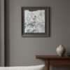 A minimalistic interior with a framed "Serrated Wrack / Fucus Serratus" Fine Art Print on a gray wall, a beige vase on a wooden console table, and part of a light-colored sofa in the foreground.