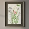 A framed fine art print titled "Serrated Wrack / Fucus Serratus" hangs on the wall, showcasing botanical artwork of delicate green seaweed against a white background, finished with a dark mat and a sleek, light-colored frame.